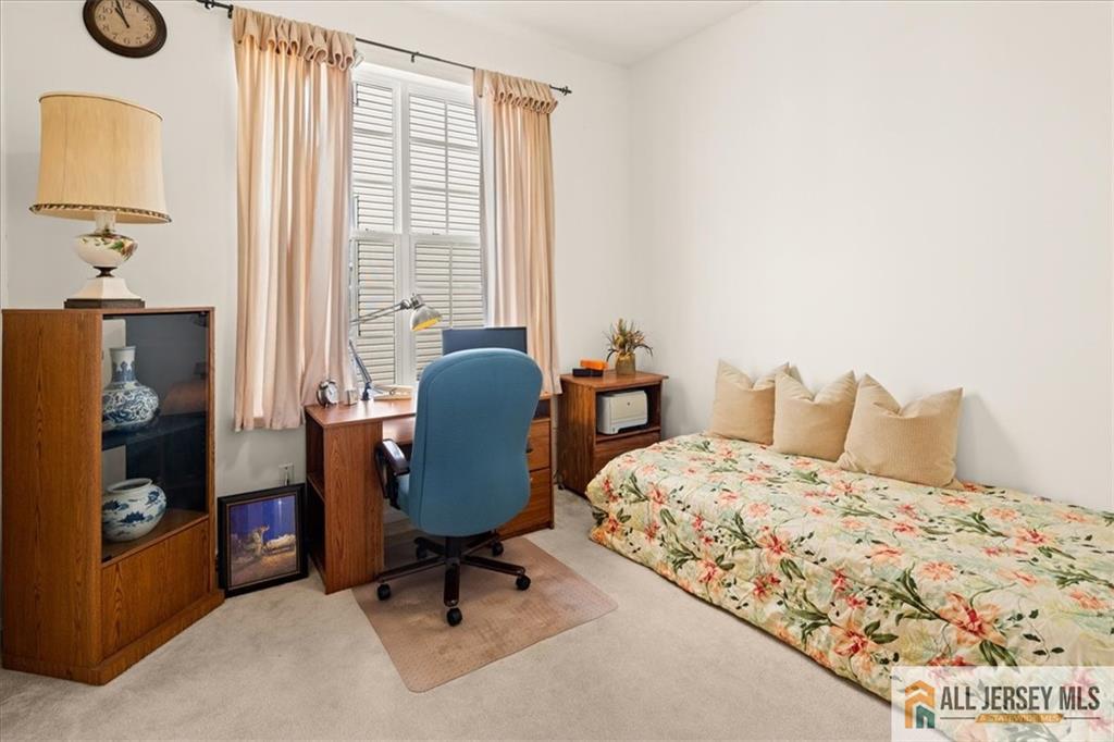 9 Bellingham Drive Kendall Park, NJ 08824 - Photo 27 of 65 a bedroom with a bed and a chair