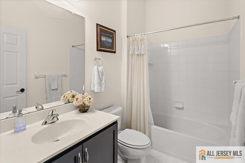 9 Bellingham Drive Kendall Park, NJ 08824 - Photo 28 of 65 a bathroom with a sink toilet and shower
