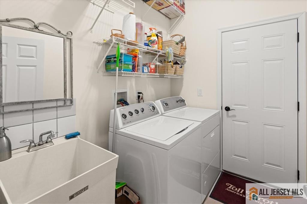 9 Bellingham Drive Kendall Park, NJ 08824 - Photo 36 of 65 a utility room with dryer and washer