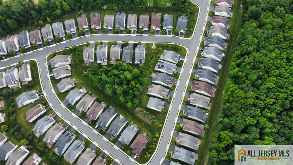 9 Bellingham Drive Kendall Park, NJ 08824 - Photo 43 of 65 a view of an swimming pool with outdoor seating