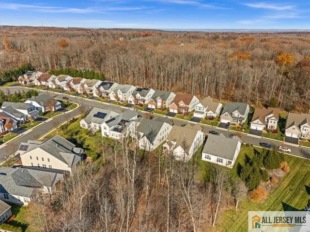 a park view with a bench and a lake view
