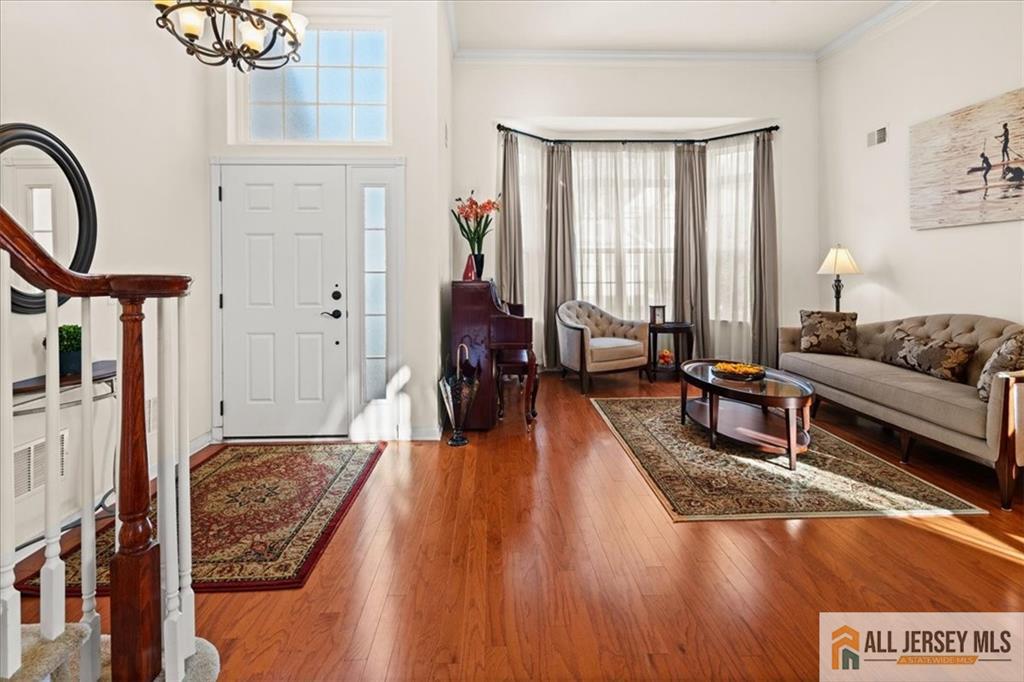 9 Bellingham Drive Kendall Park, NJ 08824 - Photo 5 of 65 a living room with furniture and a large window