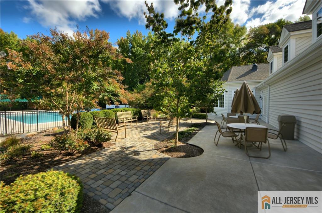9 Bellingham Drive Kendall Park, NJ 08824 - Photo 61 of 65 a view of a backyard with sitting area