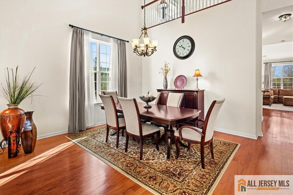 9 Bellingham Drive Kendall Park, NJ 08824 - Photo 10 of 65 a view of a dining room with furniture window and wooden floor