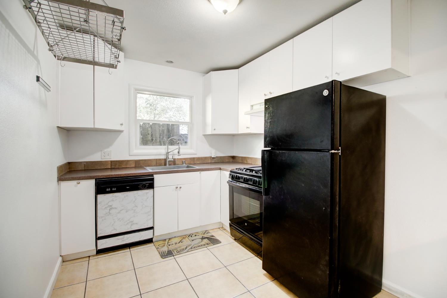 2500 Ethan Way Sacramento, CA 95821 - Photo 2 of 47 Updated kitchen with large pot rack, fridge and freestanding gas stove