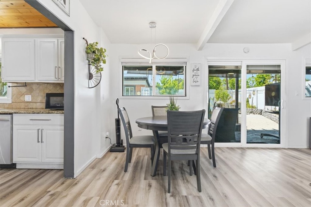 7959 Bothwell Road Reseda, CA 91335 - Photo 12 of 60 a view of a dining room with furniture window and wooden floor