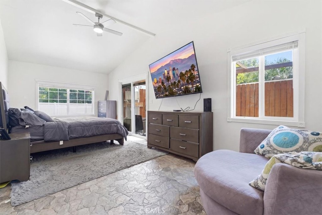 7959 Bothwell Road Reseda, CA 91335 - Photo 16 of 60 a bedroom with a bed and wooden floor