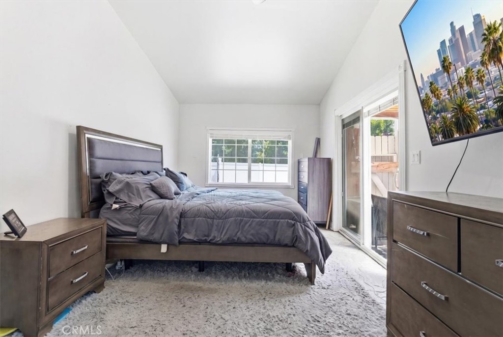 7959 Bothwell Road Reseda, CA 91335 - Photo 17 of 60 a spacious bedroom with a bed and a dresser