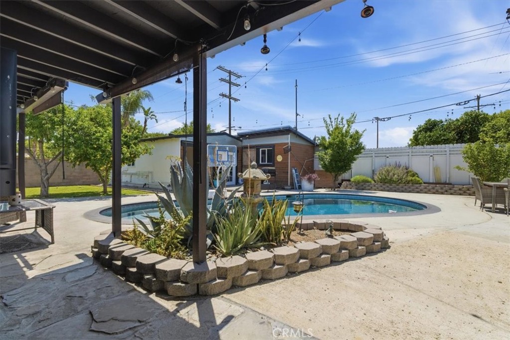 7959 Bothwell Road Reseda, CA 91335 - Photo 30 of 60 a view of a swimming pool with chairs and plants