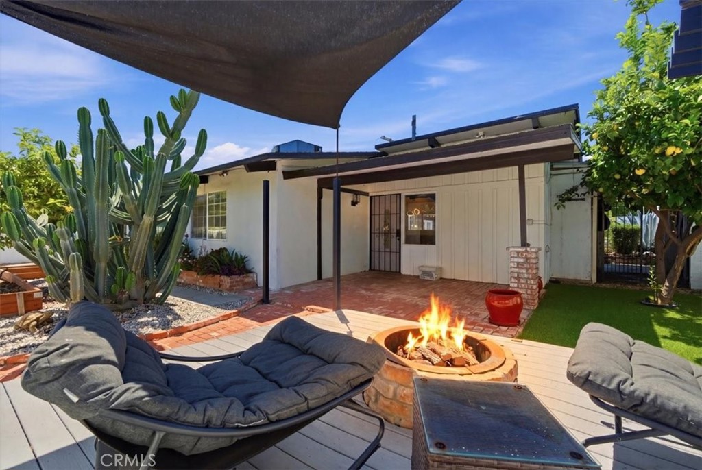 7959 Bothwell Road Reseda, CA 91335 - Photo 3 of 60 a view of a backyard with furniture and a fire pit