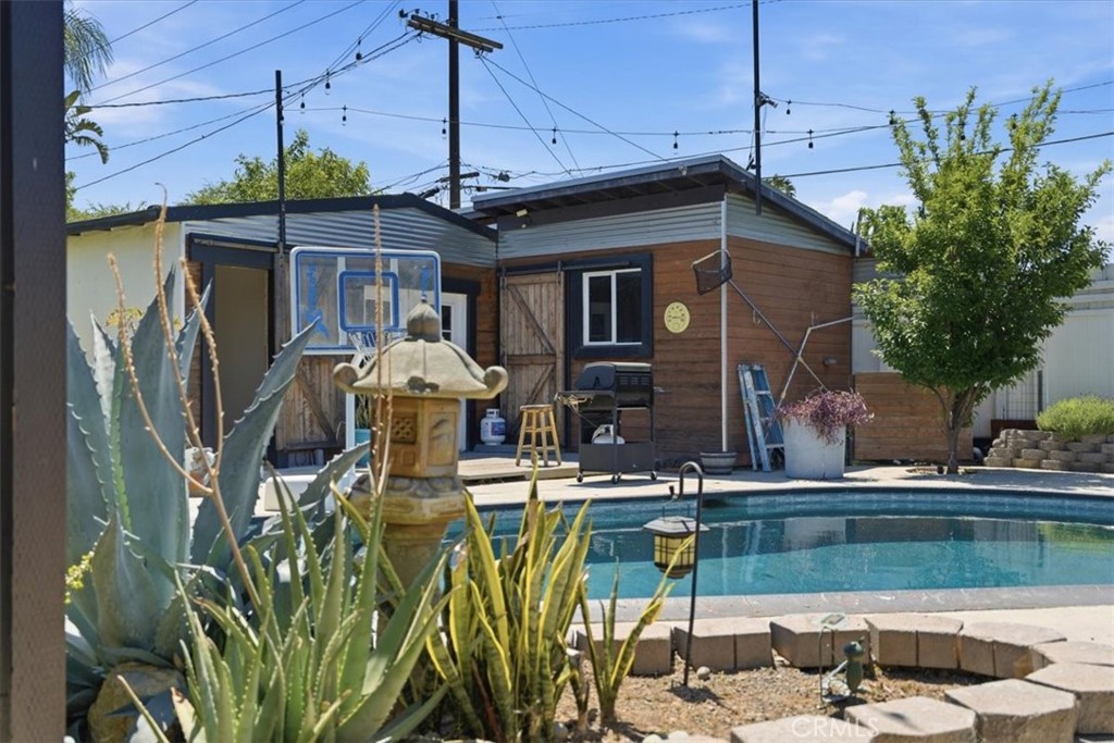7959 Bothwell Road Reseda, CA 91335 - Photo 31 of 60 a view of a house with patio outdoor seating area