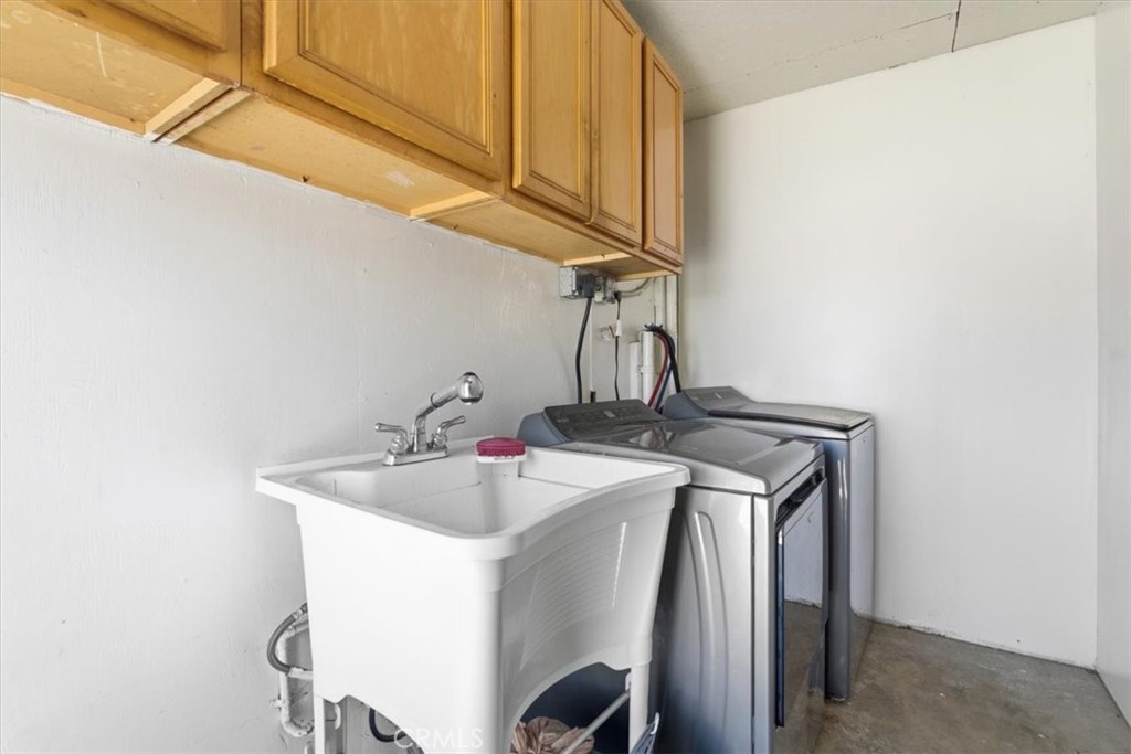 7959 Bothwell Road Reseda, CA 91335 - Photo 32 of 60 a bathroom with a sink and a mirror