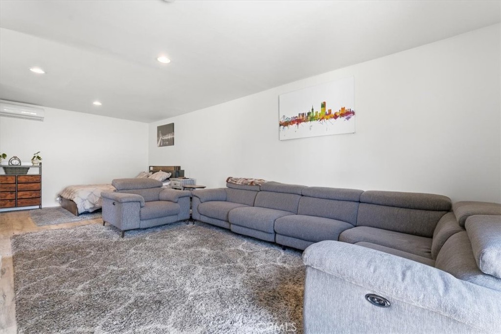 7959 Bothwell Road Reseda, CA 91335 - Photo 33 of 60 a living room with furniture and a couch
