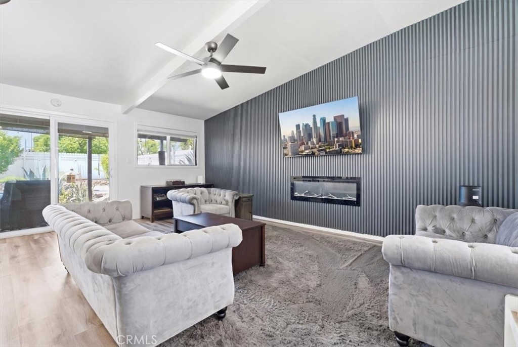 7959 Bothwell Road Reseda, CA 91335 - Photo 4 of 60 a living room with furniture and a large window