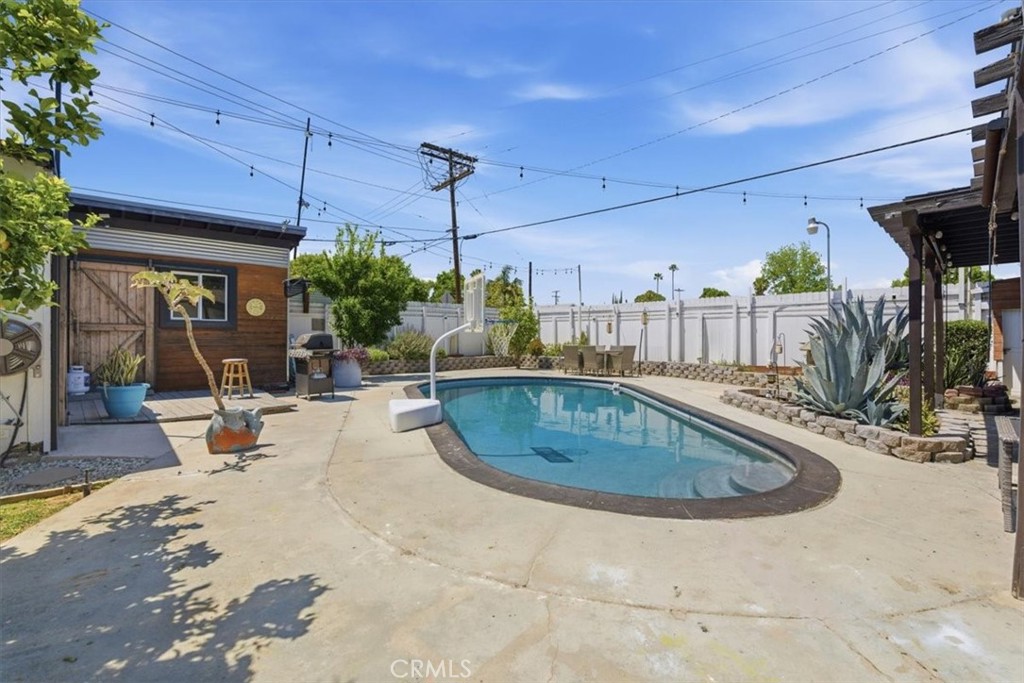 7959 Bothwell Road Reseda, CA 91335 - Photo 41 of 60 a view of a swimming pool with a patio