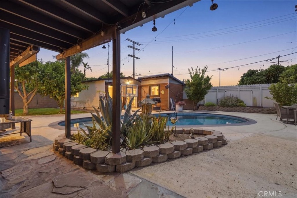 7959 Bothwell Road Reseda, CA 91335 - Photo 46 of 60 a view of a porch with a table and chairs under an umbrella