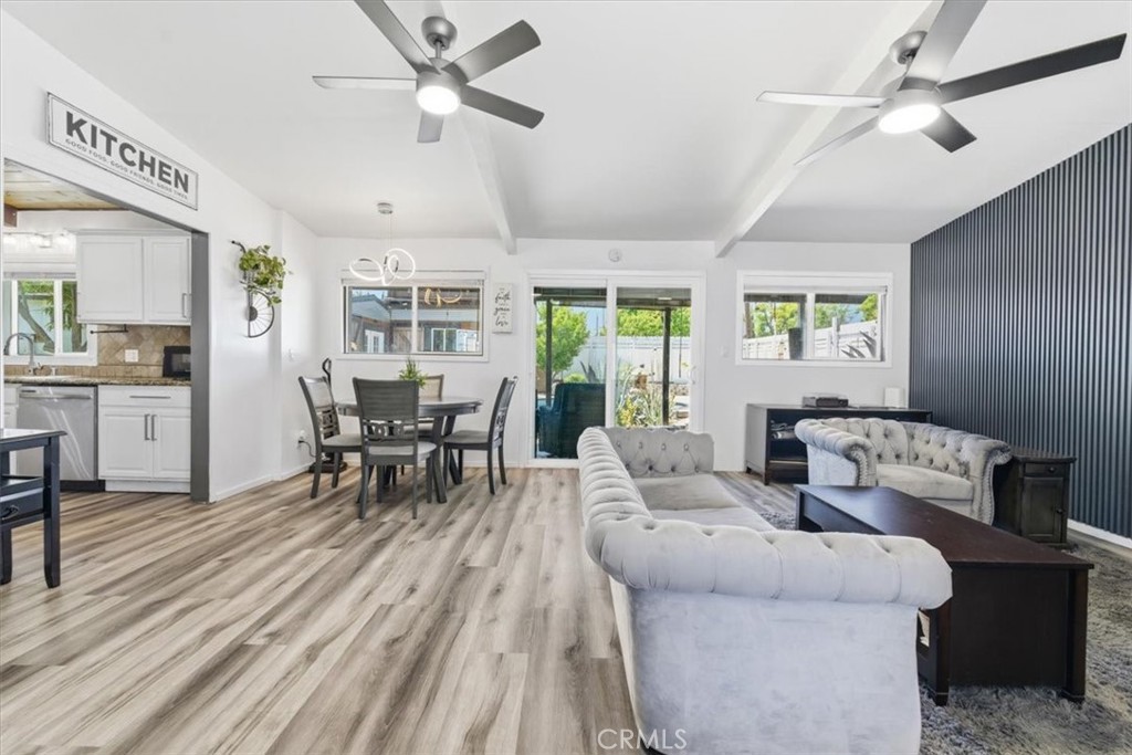 7959 Bothwell Road Reseda, CA 91335 - Photo 8 of 60 a living room with furniture and a wooden floor