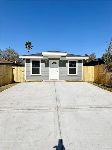 a front view of a house with a garage