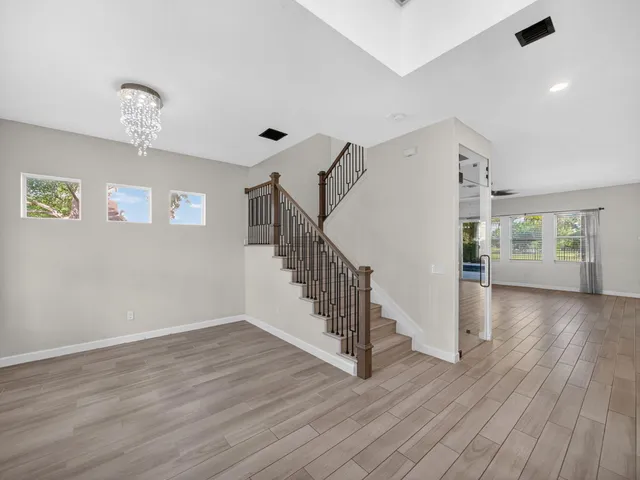 a view of entryway with wooden floor