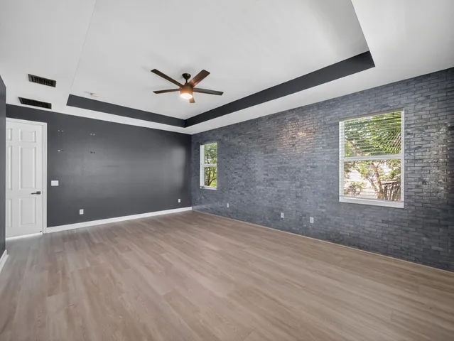 a room with a window and wooden floor