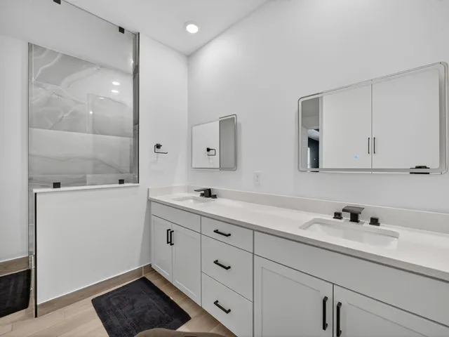 a view of a patio with a table and chairs