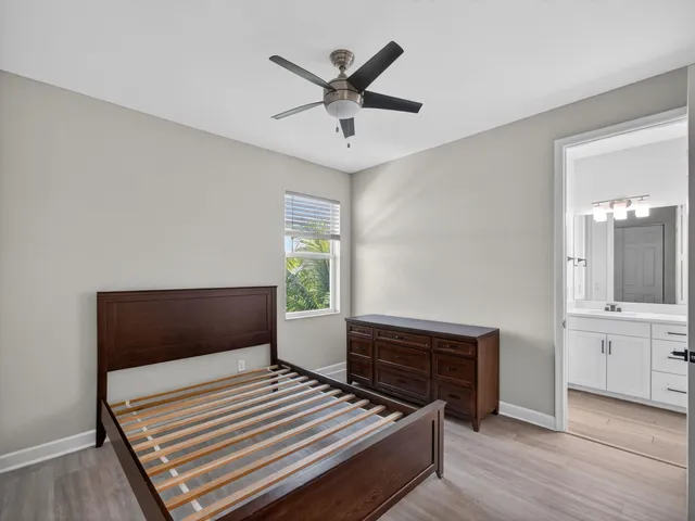 a view of a swimming pool and lounge chairs