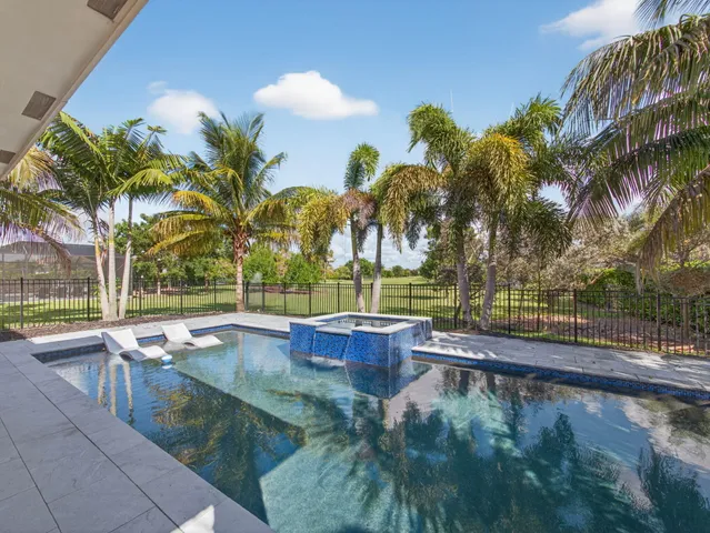 a living room with lots of furniture and a chandelier