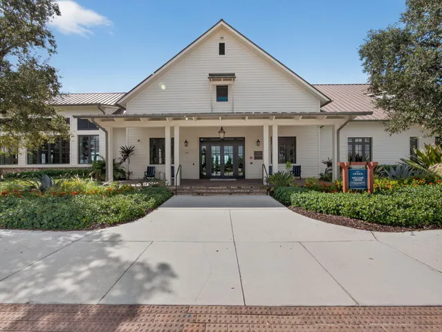 an aerial view of a house with a ocean view