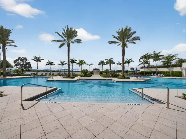 an aerial view of a house with a lake view