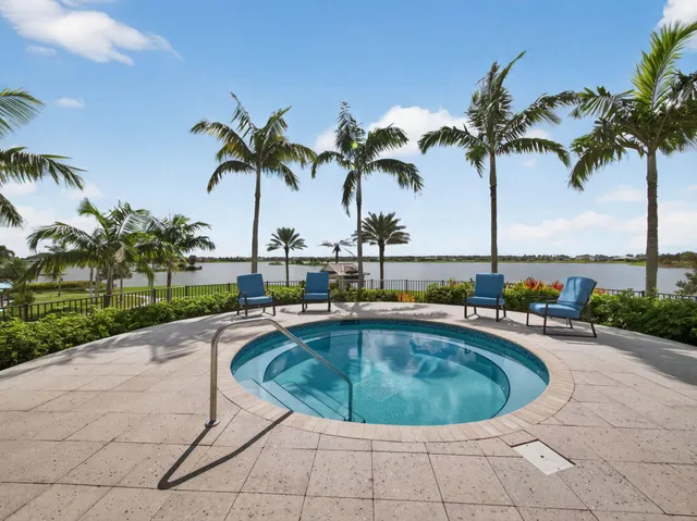 a front view of a house with a yard and a garage