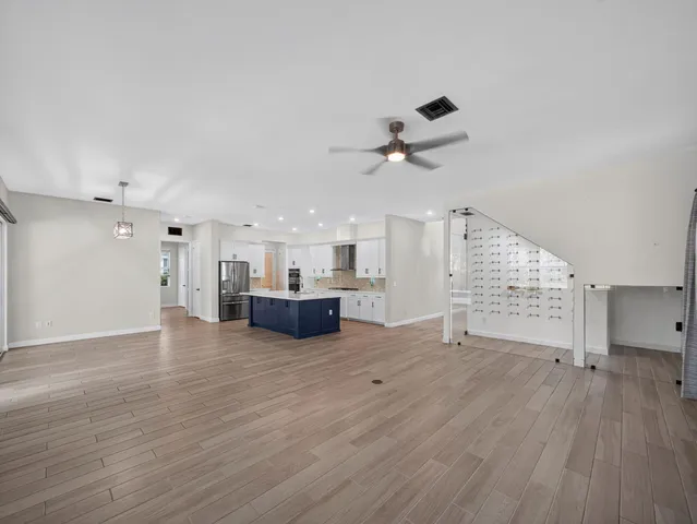 a view of an entryway with wooden floor
