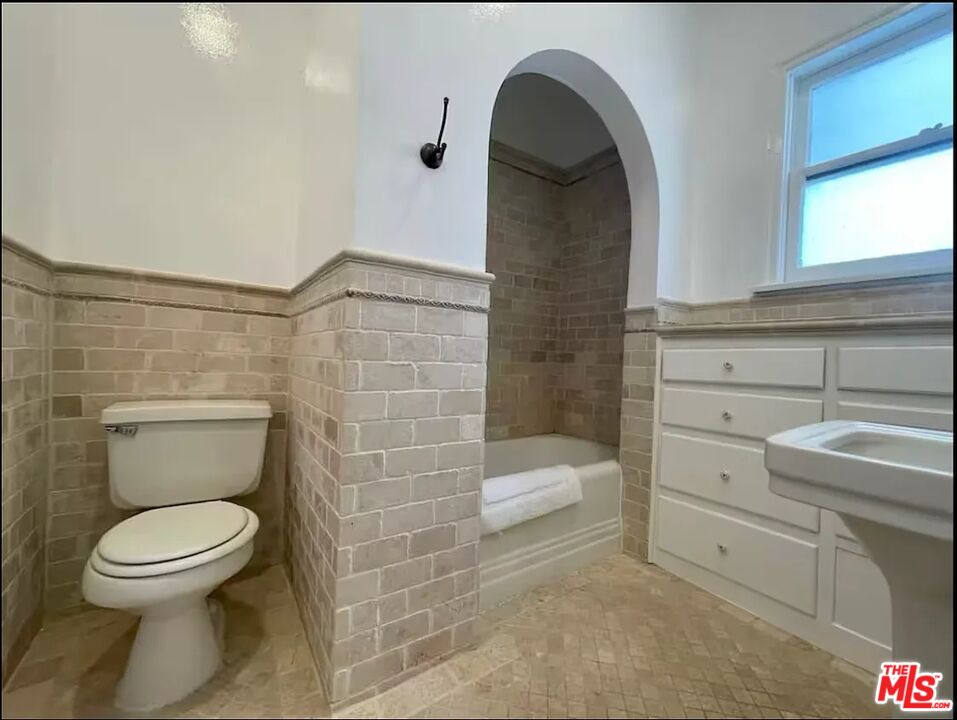 854 4th Street, Unit C Santa Monica, CA 90403 - Photo 11 of 12 a bathroom with a toilet and a shower