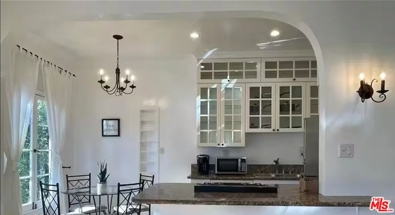 854 4th Street, Unit C Santa Monica, CA 90403 - Photo 7 of 12 a view of a kitchen with granite countertop stainless steel appliances and a chandelier