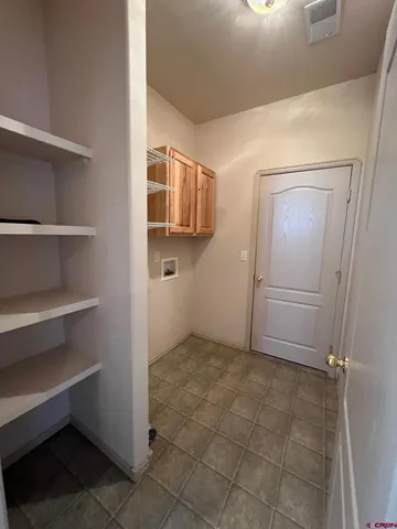 a view of an empty walk in closet
