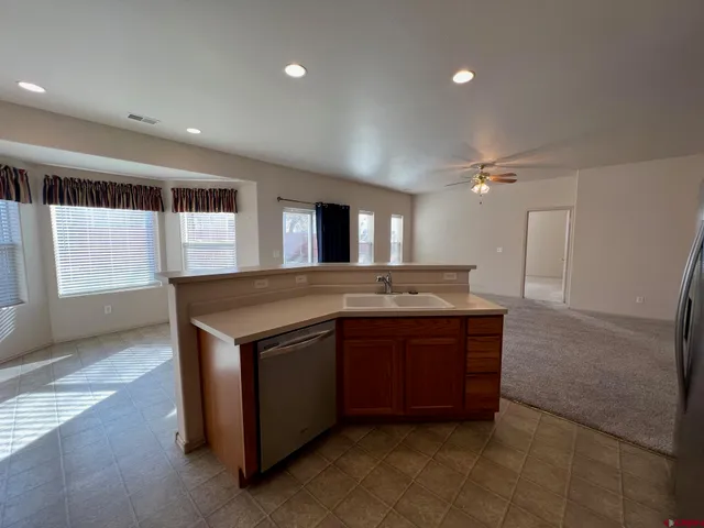 a kitchen with a stove and a sink