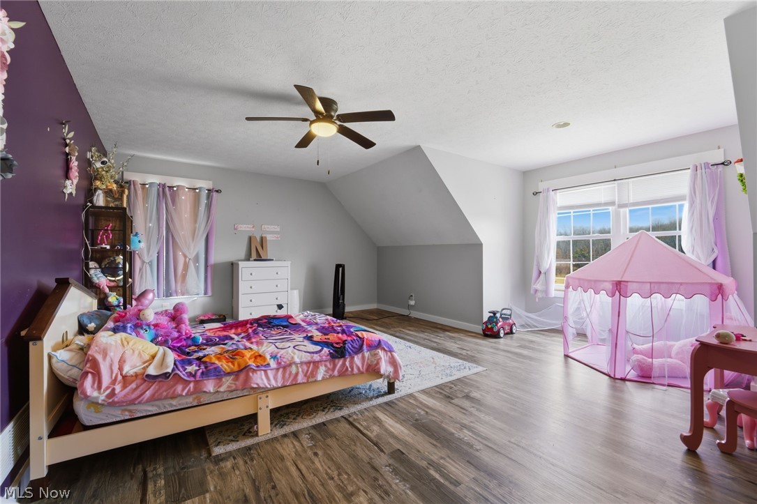 3913 Ninevah Road Ashtabula, OH 44004 - Photo 24 of 37 Bedroom featuring wood finished floors and ceiling fan