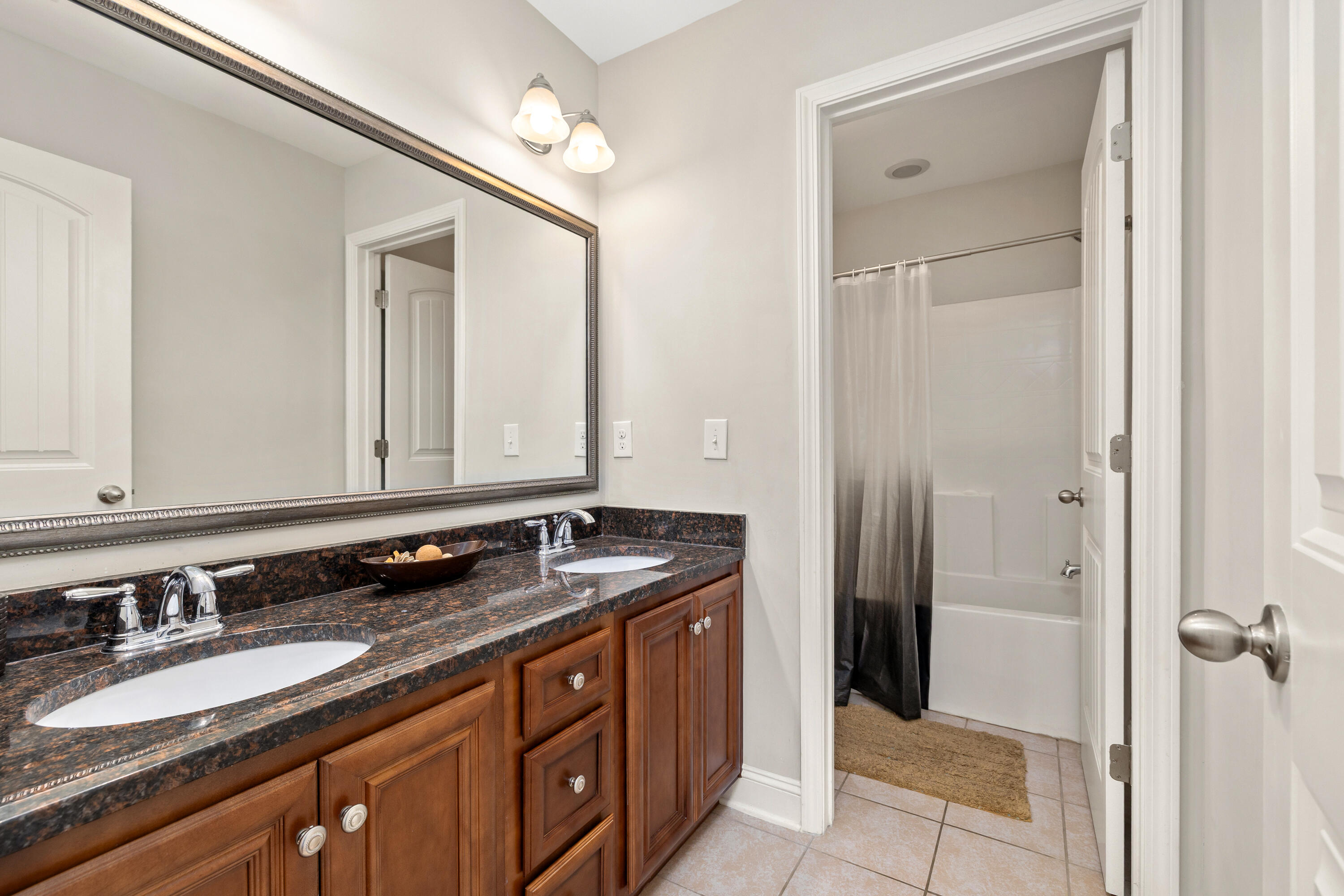565 Curlew Circle Sumter, SC 29150 - Photo 36 of 46 hall bathroom upstairs -Double vanities and separate room with Toilet and Shower/Tub Combo