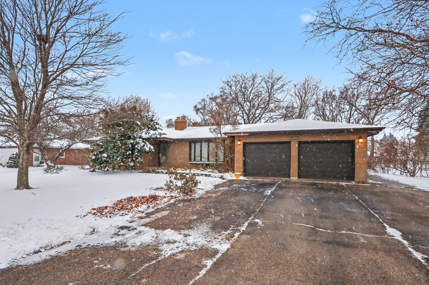 24304 South Frontage Road West Channahon, IL 60410 - Photo 1 of 26 a view of a house with a yard covered in snow