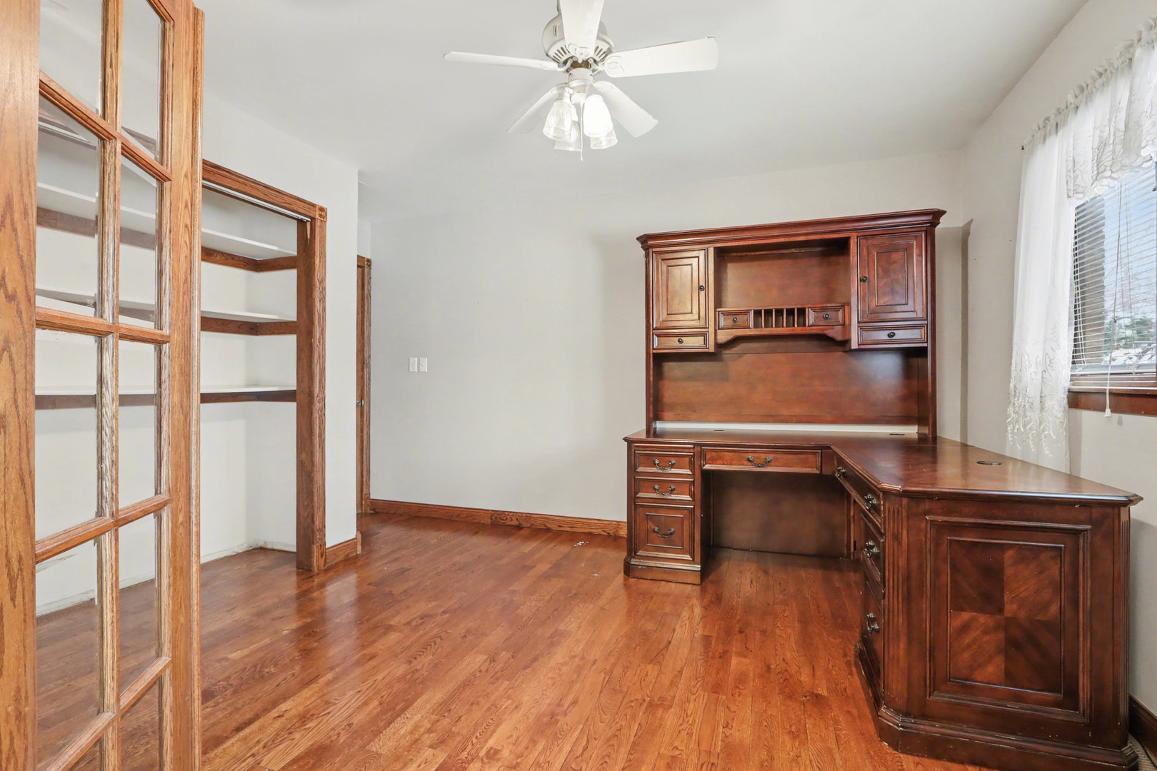 24304 South Frontage Road West Channahon, IL 60410 - Photo 11 of 26 an empty room with wooden floor fan and windows