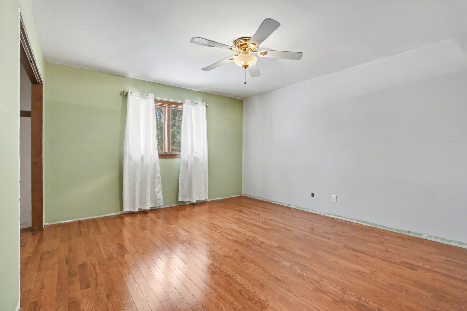 24304 South Frontage Road West Channahon, IL 60410 - Photo 16 of 26 wooden floor in an empty room with a window