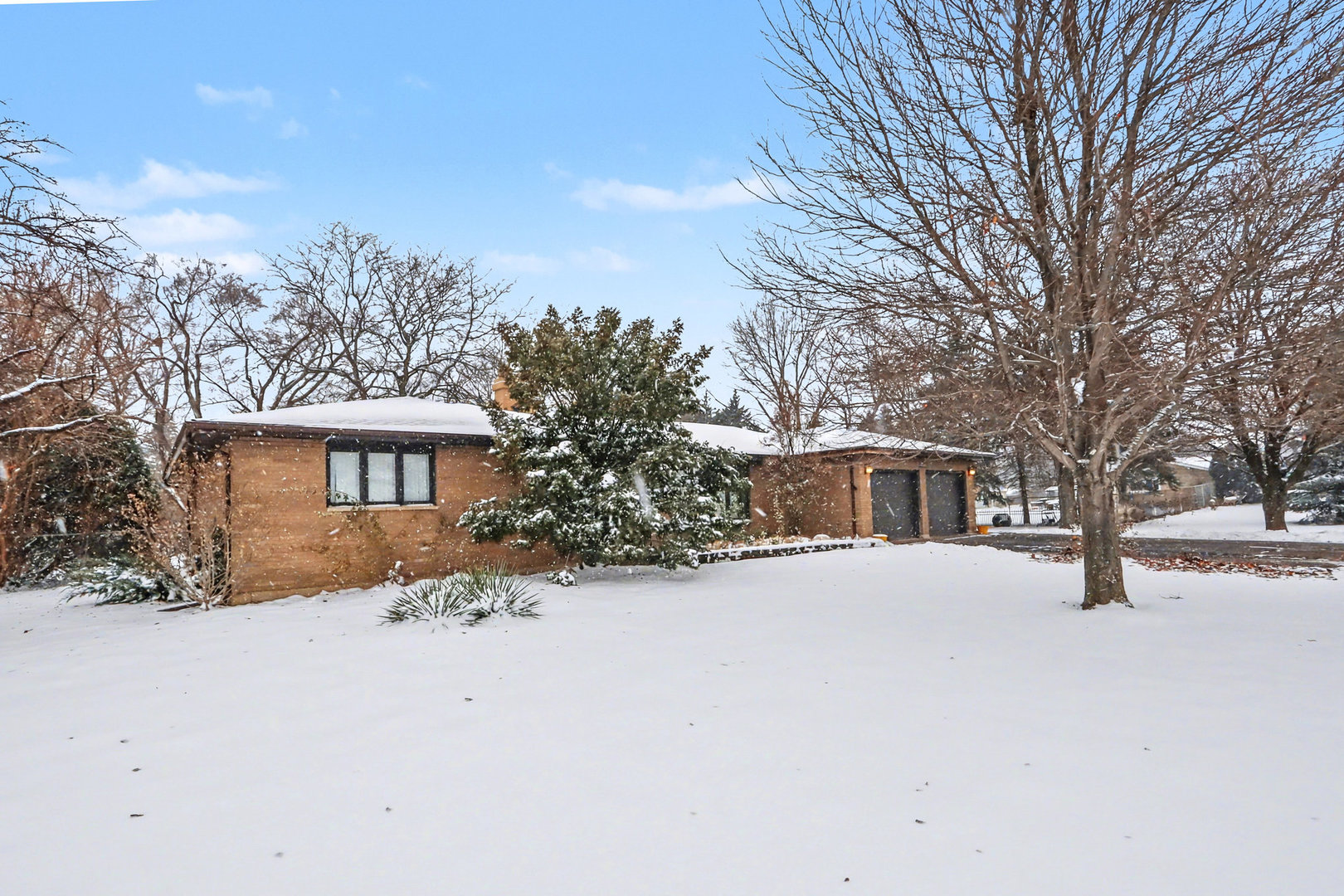 24304 South Frontage Road West Channahon, IL 60410 - Photo 23 of 26 a front view of a house with a yard covered in snow