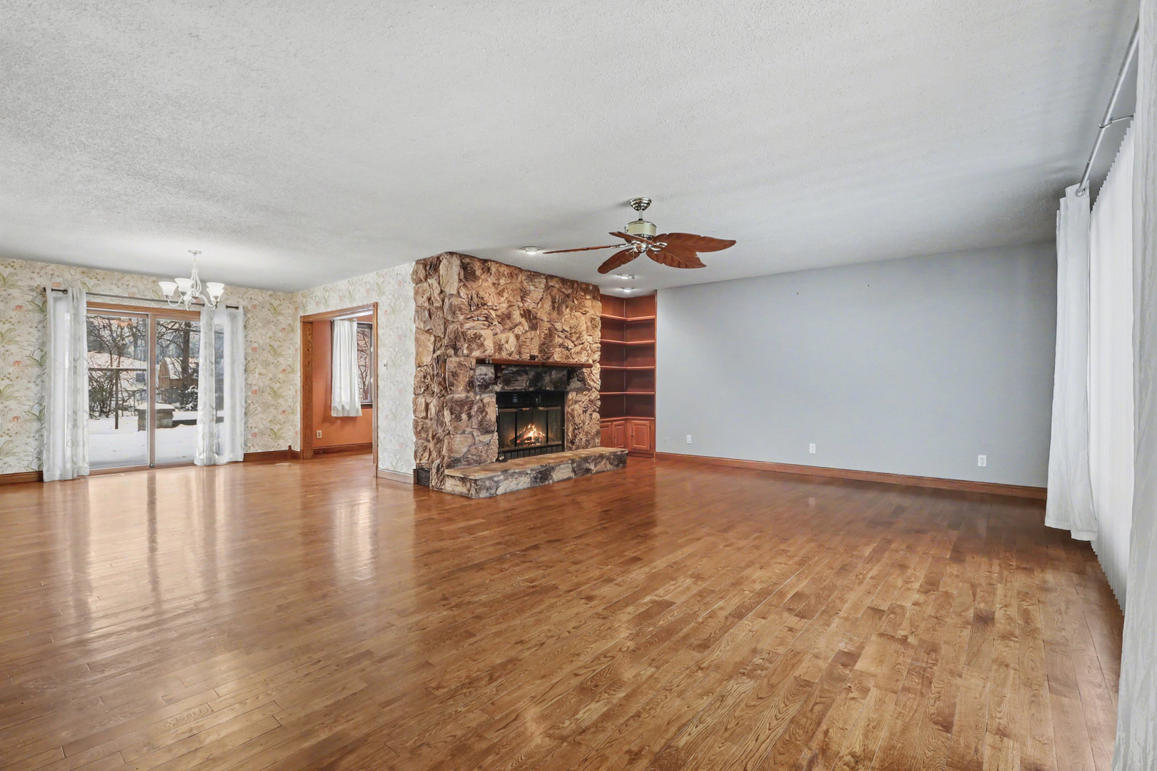 24304 South Frontage Road West Channahon, IL 60410 - Photo 3 of 26 a view of empty room with fireplace and wooden floor