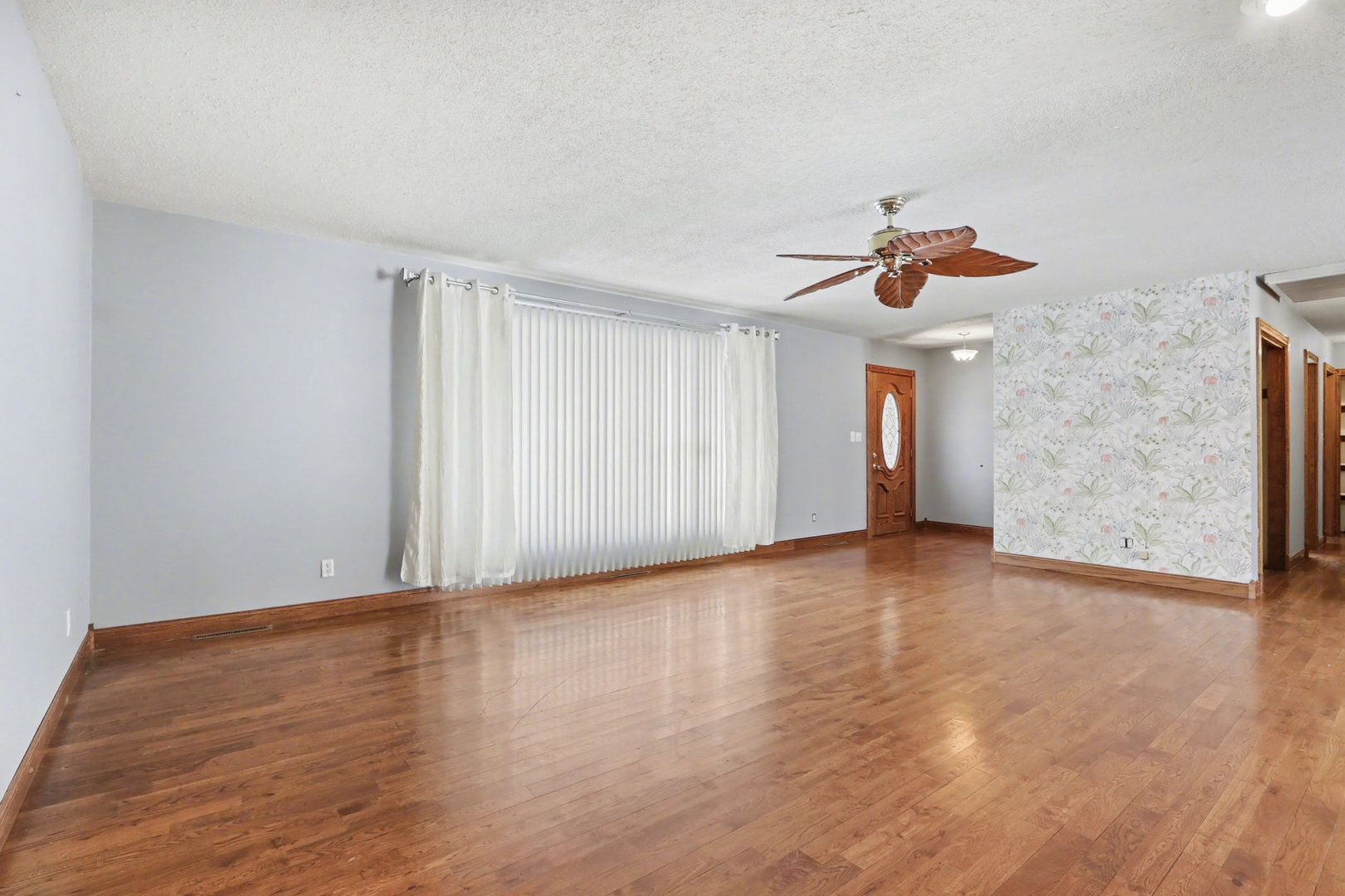 24304 South Frontage Road West Channahon, IL 60410 - Photo 5 of 26 a view of an empty room with wooden floor and a window