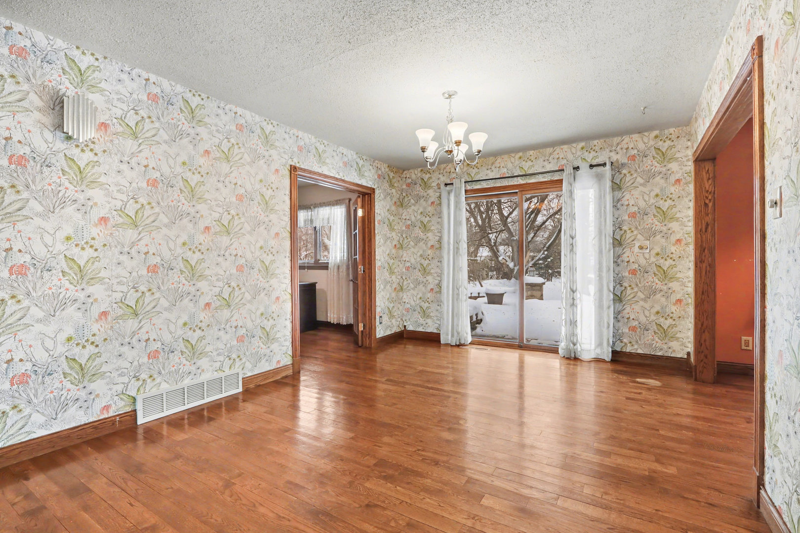 24304 South Frontage Road West Channahon, IL 60410 - Photo 7 of 26 an empty room with wooden floor and windows