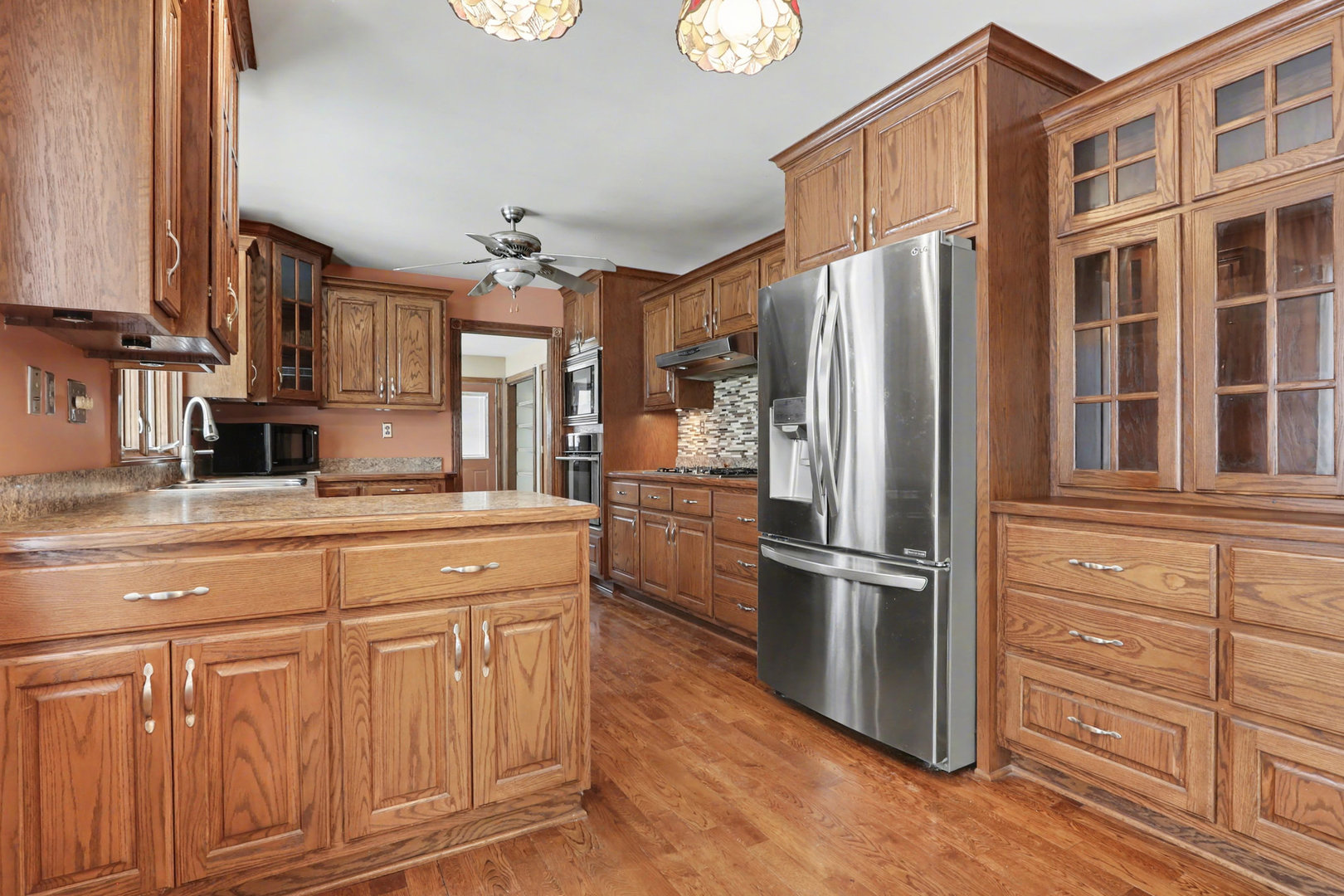 24304 South Frontage Road West Channahon, IL 60410 - Photo 8 of 26 a kitchen with stainless steel appliances granite countertop a refrigerator and a stove top oven