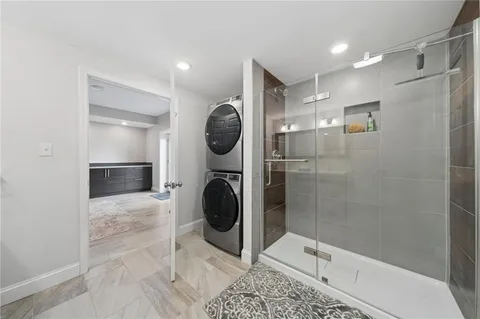 a bathroom with a toilet and a shower