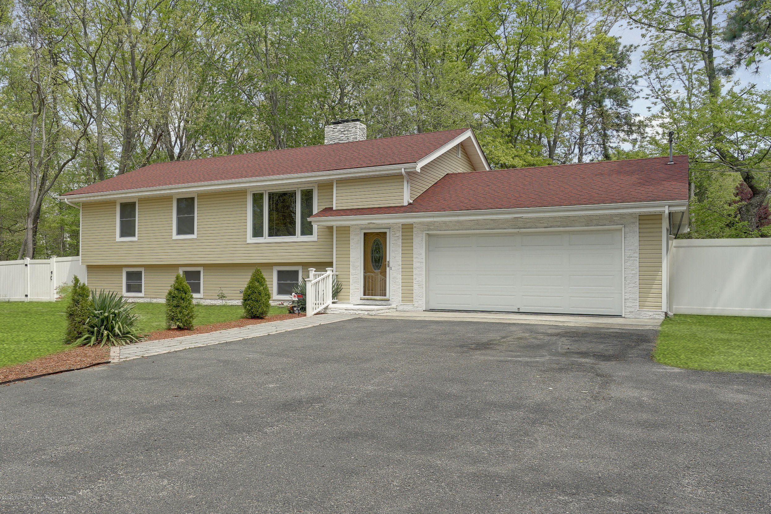 59 Pinewood Road Howell, NJ 07731 - Photo 2 of 31 front view of a house with a street