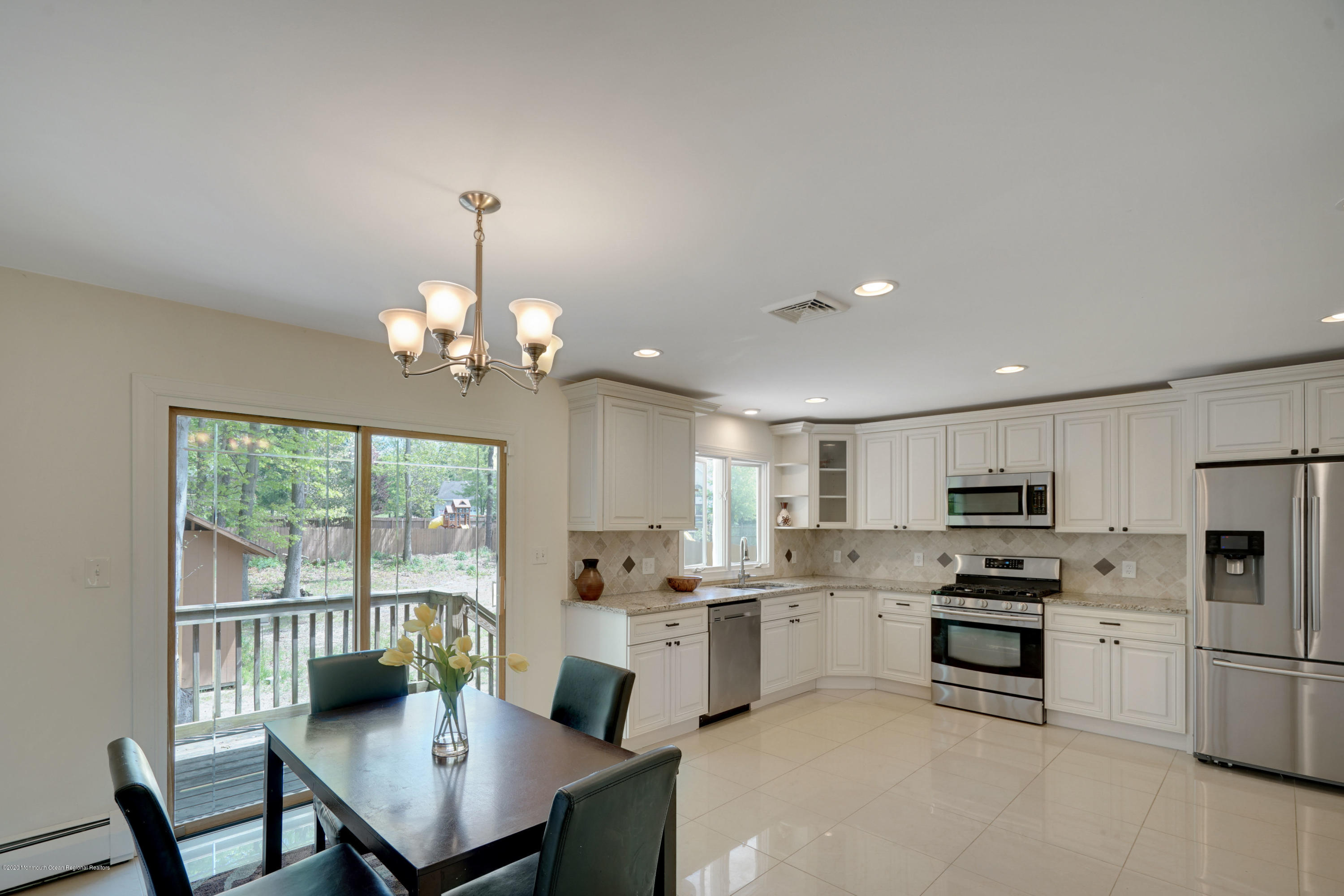 59 Pinewood Road Howell, NJ 07731 - Photo 8 of 31 a kitchen with counter top space cabinets and stainless steel appliances