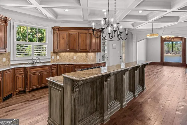 a spacious bathroom with a granite countertop tub sink a mirror a shower and vanity