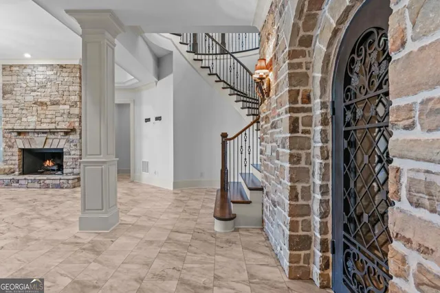 a view of a swimming pool with lawn chairs and plants